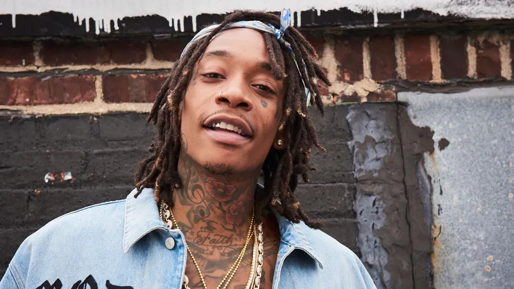 Wiz Khalifa got angry at the man who threw money at him during his performance.