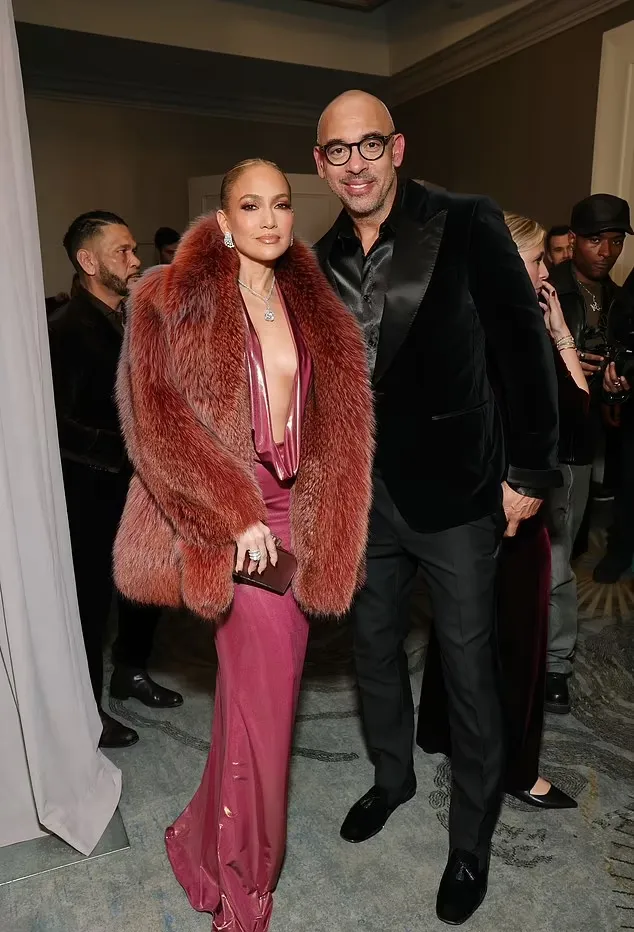 Jennifer Lopez Turns Heads at Pre-GRAMMY Party in Bold Red Dress 2 Jennifer Lopez Turns Heads at Pre-GRAMMY Party in Bold Red Dress