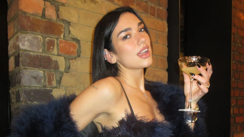 Dua Lipa celebrates major career milestone in a dreamy fluffy coat