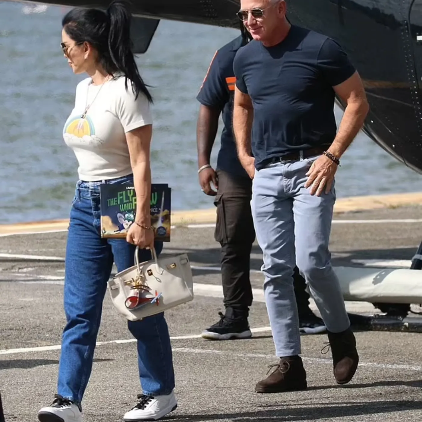 Jeff Bezos Cuts a Casual Figure While His Fiancée Lauren Sanchez Carries a £28,000 Hermes Handbag as the Pair Arrive by Helicopter in New York